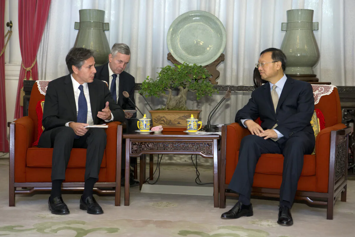 Then-U.S. Deputy Secretary of State Antony Blinken (L) speaks with Chinese State Councilor Yang Jiechi during a meeting in Beijing on Oct. 8, 2015. (Mark Schiefelbein, Pool/AP)
