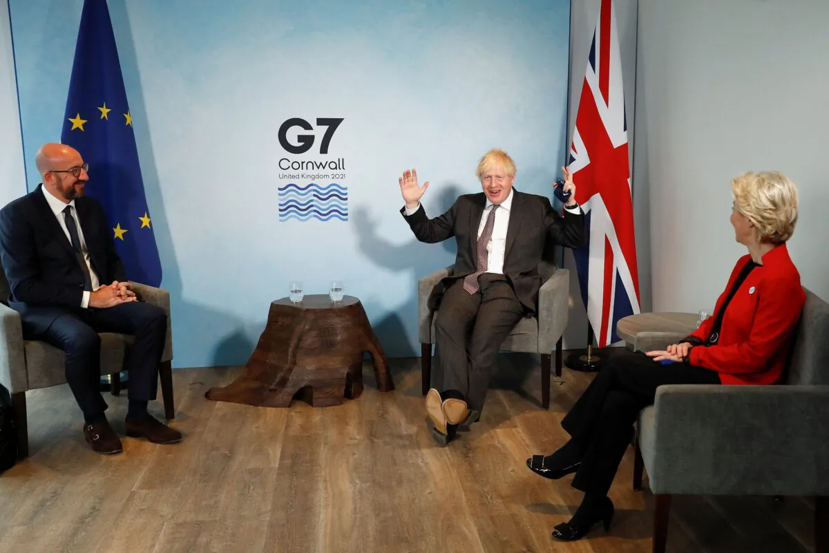 Britain's Prime Minister Boris Johnson (C) greets President of the European Council Charles Michel (L) and President of the European Commission Ursula von der Leyen prior to a bilateral meeting during the G7 summit in Carbis bay, Cornwall, on June 12, 2021. (Peter Nicholls/Pool/AFP via Getty Images)