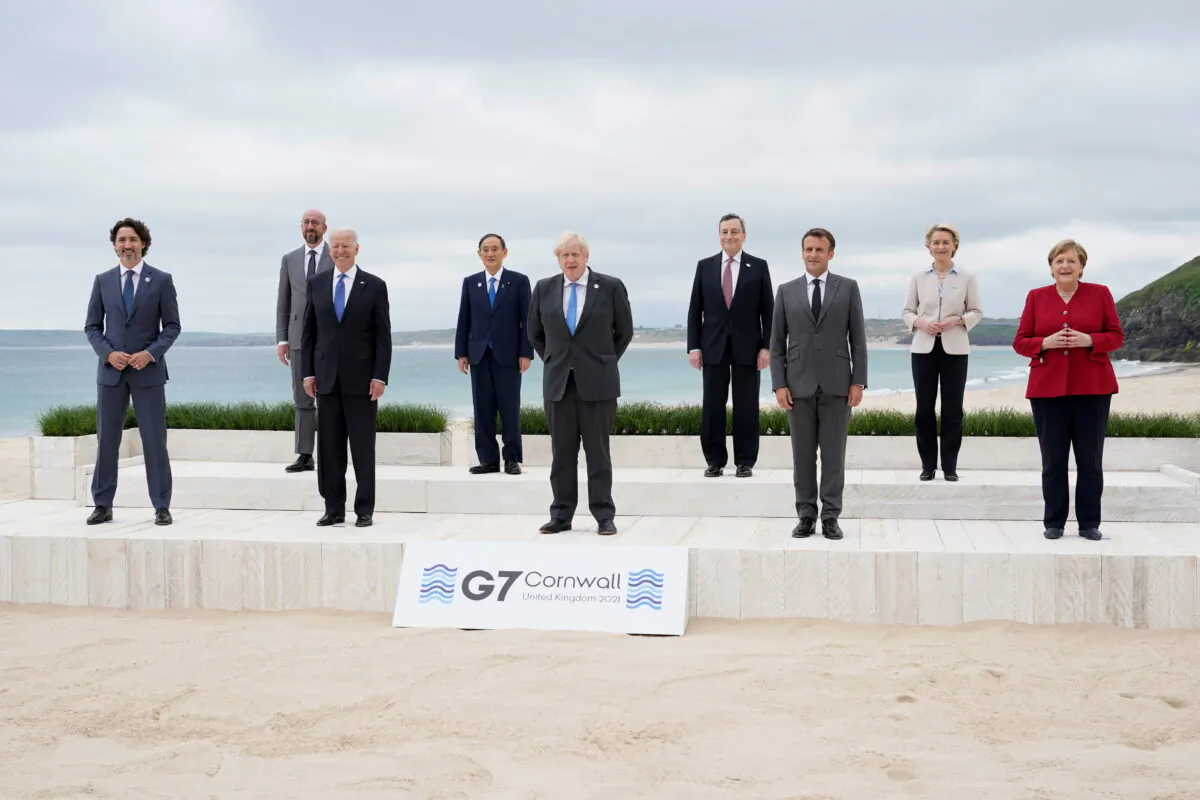 Canadian Prime Minister Justin Trudeau, European Council President Charles Michel, U.S. President Joe Biden, Japan's Prime Minister Yoshihide Suga, British Prime Minister Boris Johnson, Italy's Prime Minister Mario Draghi, French President Emmanuel Macron, European Commission President Ursula von der Leyen and German Chancellor Angela Merkel pose for a group photo at the G7 summit, in Carbis Bay, Britain, on June 11, 2021. (Patrick Semansky/Pool/Reuters)