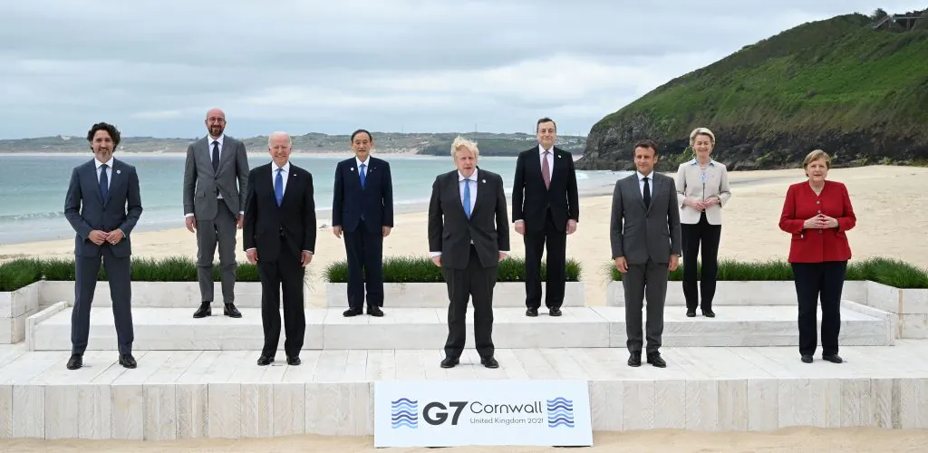 (L-R) Canada's Prime Minister Justin Trudeau, President of the European Council Charles Michel, US President Joe Biden, Japan's Prime Minister Yoshihide Suga, Britain's Prime Minister Boris Johnson, Italy's Prime minister Mario Draghi, France's President Emmanuel Macron, President of the European Commission Ursula von der Leyen and Germany's Chancellor Angela Merkel pose for the family photo at the start of the G7 summit in Carbis Bay, Cornwall on June 11, 2021. (Leon Neal/POOL/AFP via Getty Images)