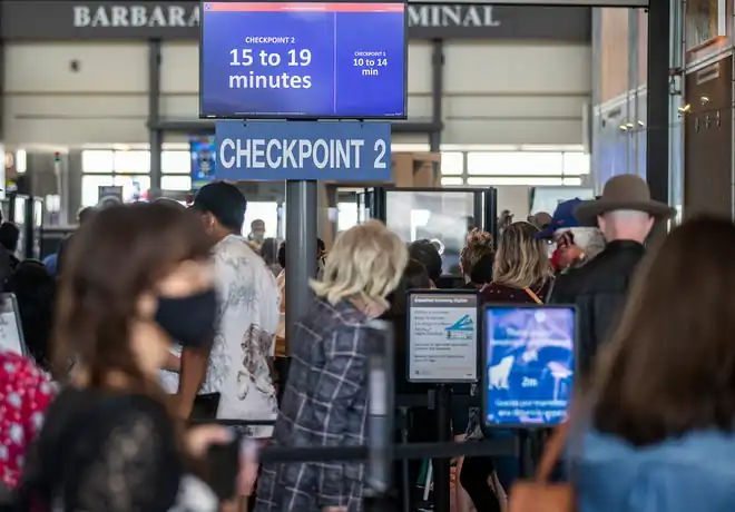 Travelers wait to go through security checkpoints at Austin-Bergstrom International Airport in Austin, Texas, on May 28, 2021. (Austin American-Statesman/TNS)