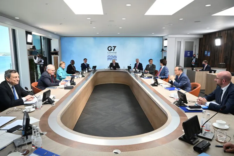 (C-L) British PM Boris Johnson, U.S. President Joe Biden, France's President Emmanuel Macron, Canadian PM Justin Trudeau, Japanese PM Yoshihide Suga, European Council President Charles Michel, Italian PM Mario Draghi, Australia's PM Scott Morrison, German Chancellor Angela Merkel, South Africa's President Cyril Ramaphosa, and South Korea's President Moon Jae-in attend a working session during the G-7 summit in Carbis Bay, Cornwall, UK, on June 12, 2021. (Leon Neal/Pool via Reuters)