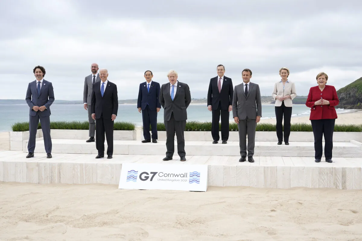 Leaders of the G-7 pose for a group photo on overlooking the beach at the Carbis Bay Hotel in Carbis Bay, St. Ives, Cornwall, England, on June 11, 2021. (Patrick Semansky/Pool/AP Photo)