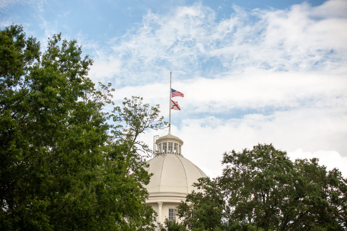 Flags fly at half-staff at the Alabama State Capitol in Montgomery, Alabama, on July 26, 2020. (Lynsey Weatherspoon/Getty Images)