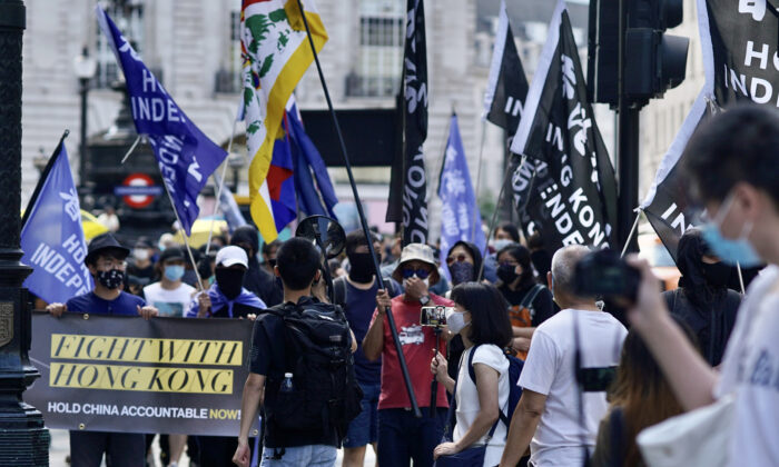 Supporters of Hong Kong's pro-democracy movement at a rally commemorating the two-year anniversary of Hong Kong's pro-democracy movement ​in London on June 12, 2021. (Yanning Qi/The Epoch Times)