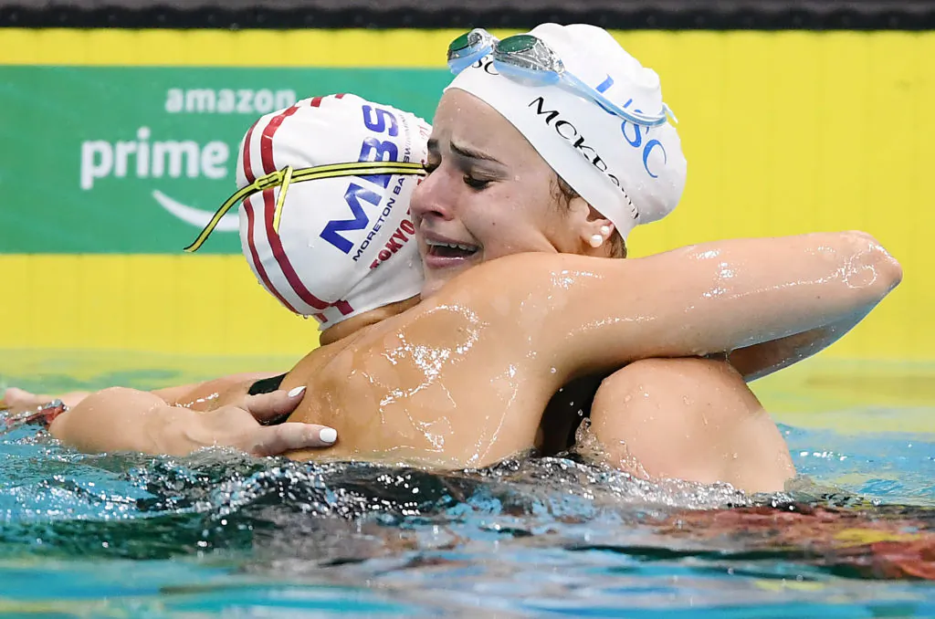 Kaylee McKeown (right) in tears hugs Minna Atherton after breaking the the world record in her Women's 100 Metre Backstroke final during the Australian National Olympic Swimming Trials at SA Aquatic & Leisure Centre in Adelaide, Australia, on June 13, 2021. (Mark Brake/Getty Images)