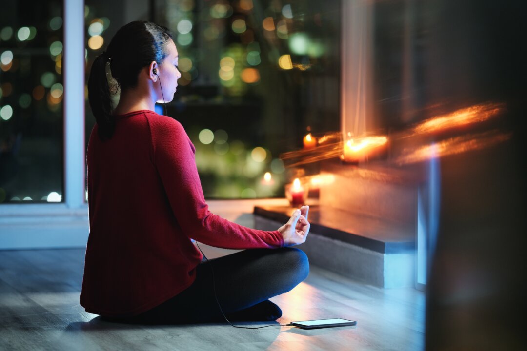 Meditating before bed
can calm your mind
and make it easier to
get a restful sleep. (Diego Cervo/Shutterstock)