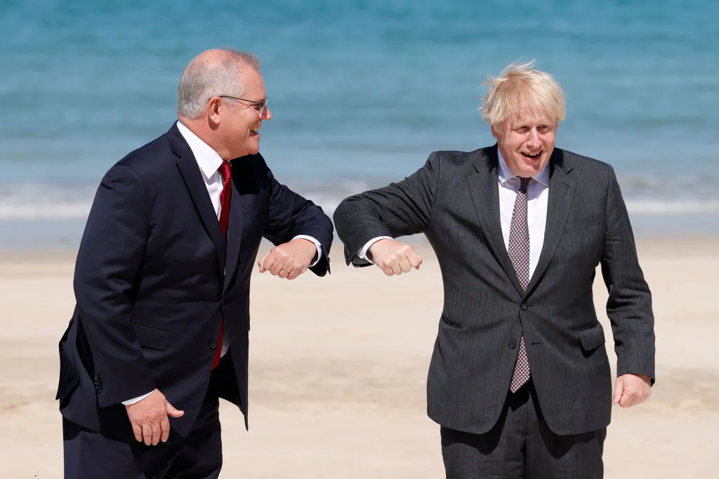Britain's Prime Minister Boris Johnson greets Australia's Prime Minister Scott Morrison at the G7 summit in Carbis Bay on June 12, 2021 in Carbis Bay, Cornwall. (Adrian Dennis-WPA Pool/Getty Images)