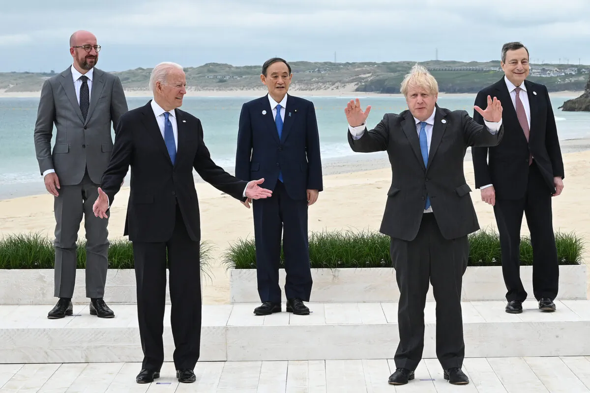 (L-R) President of the European Council Charles Michel, U.S. President Joe Biden, Japanese PM Yoshihide Suga, British PM Boris Johnson, and Italian PM Mario Draghi pose for the Leaders official welcome and family photo during the G7 Summit in Carbis Bay, Cornwall, on June 11, 2021. (Leon Neal/WPA Pool/Getty Images)