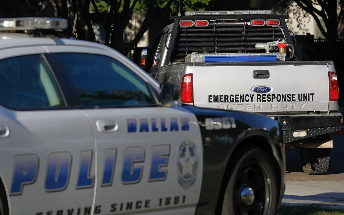 A Dallas police car and an emergency response vehicle sit in a parking lot in Dallas, Texas, in this file photo taken on Oct. 16, 2014. (Mike Stone/Getty Images)