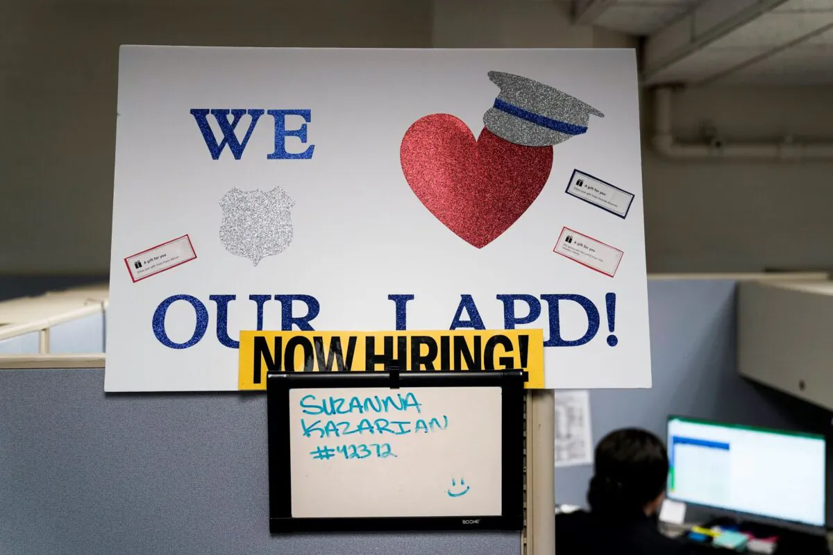 A "Now Hiring" sign is placed on a cubicle wall in the office of the Los Angeles Police recruitment and employment division in Los Angeles, Calif., On Sept. 9, 2020. (Jae C. Hong/AP Photo)