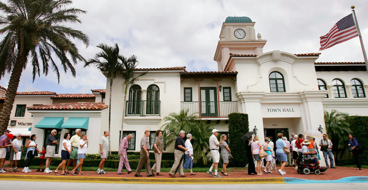 Voters wait to cast their ballots outside a polling place in Palm Beach County in West Palm Beach, Fla., on Nov. 2, 2004. (Mario Tama/Getty Images)