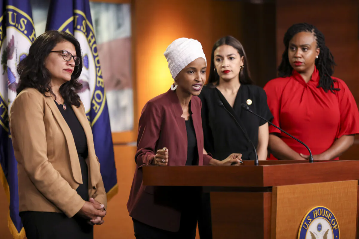 (L-R) Rep. Rashida Tlaib (D-Mich.), Rep. Ilhan Omar (D-Minn.), Rep. Alexandria Ocasio-Cortez (D-N.Y.), and Rep. Ayanna Pressley (D-Mass.) speak at a press conference on the Capitol on July 15, 2019. (Holly Kellum/NTD)