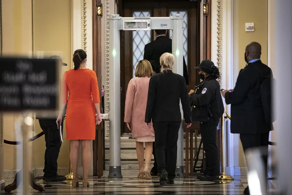 Speaker of the House Nancy Pelosi (D-Calif.) walks through a metal detector before entering the House Chamber at the U.S. Capitol in Washington on Jan. 21, 2021. (Drew Angerer/Getty Images)