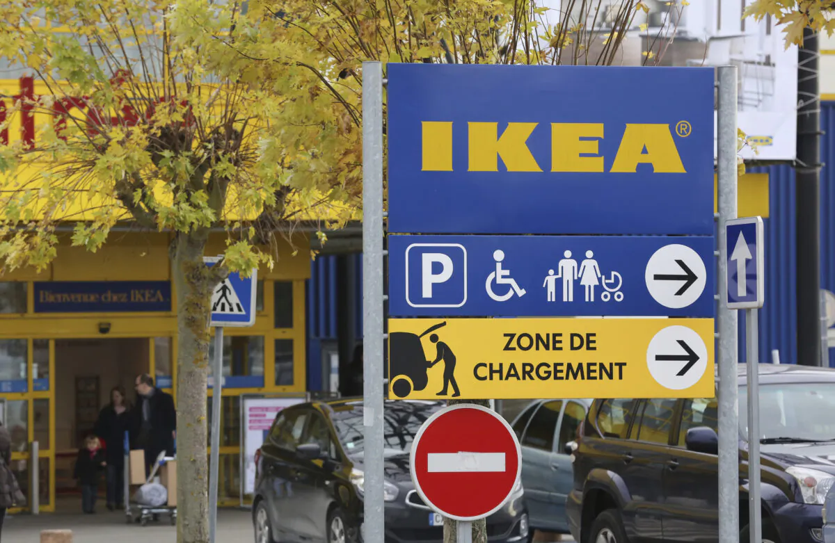 Customers leave an IKEA store in Plaisir, west of Paris, on Nov. 30, 2013. (Remy de la Mauviniere/AP Photo)