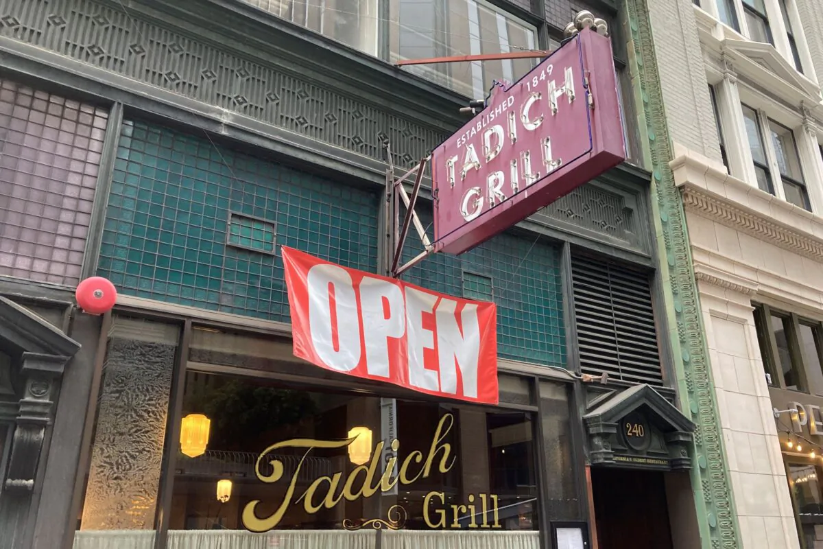 An open banner hangs outside the Tadich Grill, California's oldest restaurant, in San Francisco on June 4, 2021. (Eric Risberg/AP Photo)