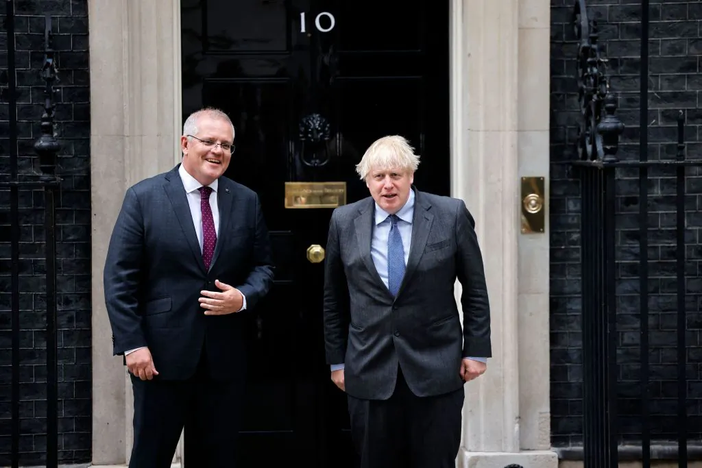 Britain's Prime Minister Boris Johnson (R) poses for a photograph with Australia's Prime Minister Scott Morrison (L) on the steps of 10 Downing Street in London on June 14, 2021. (Tolga Akmen/AFP via Getty Images)