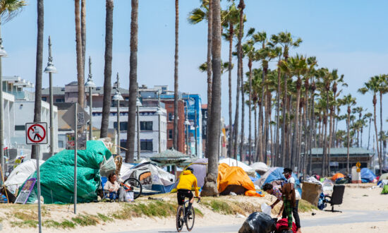 Triathlon Athletes Ride Past Homeless Encampments in Venice Beach