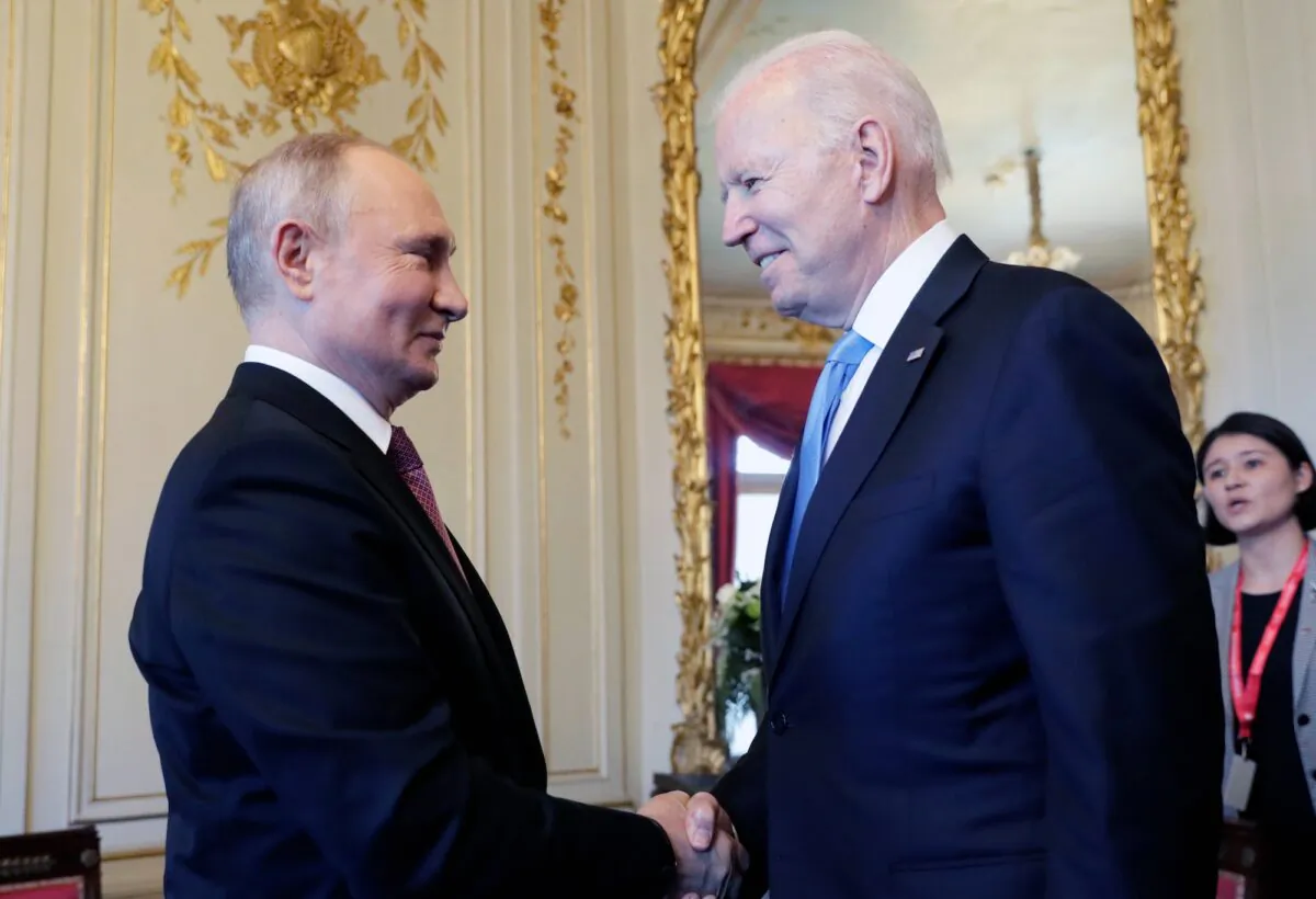 President Joe Biden and Russian President Vladimir Putin shake hands during their meeting in Geneva, Switzerland, on June 16, 2021. (Mikhail Metzel/Pool Photo via AP)