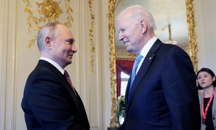 President Joe Biden and Russian President Vladimir Putin shake hands during their meeting in Geneva, Switzerland, on June 16, 2021. (Mikhail Metzel/Pool Photo via AP)