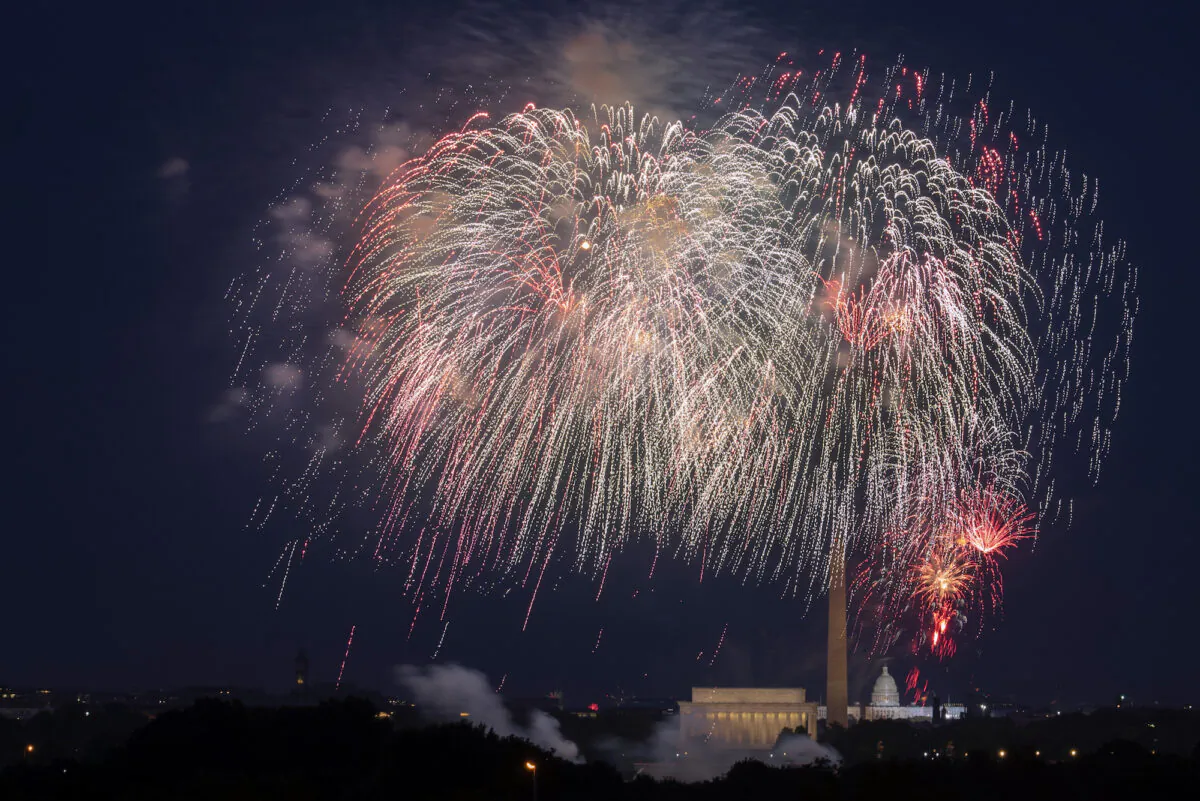 Fourth of July fireworks explode over the Lincoln Memorial, Washington Monument and U.S. Capitol, on July 4, 2020. (AP Photo/Cliff Owen)