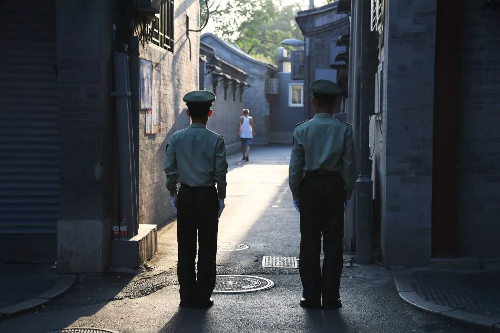 Chinese paramilitary police guard an alley in a street next to Tiananmen Square ahead of an overnight rehearsal of a military parade to mark Communist China's 70th anniversary, in Beijing on Sept. 7, 2019. (Greg Baker/AFP via Getty Images)
