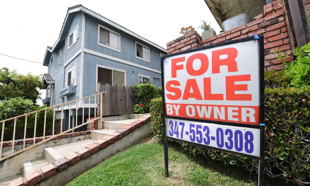 A "For Sale by Owner" sign is posted in front of property in Monterey Park, California on April 29, 2020. (Photo by Frederic J. Brown/AFP via Getty Images)