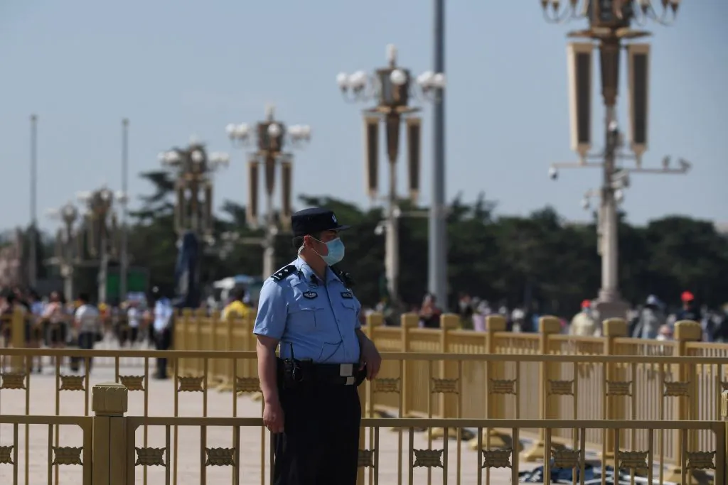 A police officer keeps watch in Tiananmen Square in Beijing on the 32nd anniversary of the deadly 1989 crackdown on pro-democracy protests, on June 4, 2021. (GREG BAKER/AFP via Getty Images)