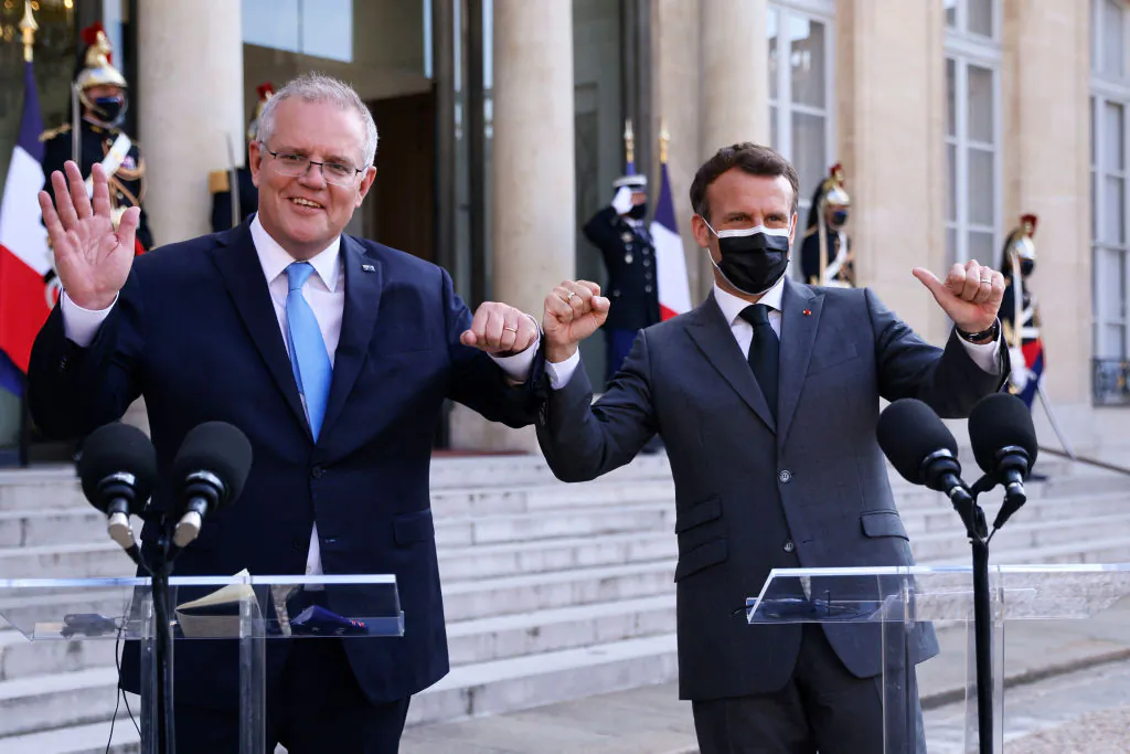 French President Emmanuel Macron (R) and Australia's Prime Minister Scott Morrison answer the press prior to a working diner at the Elysee Palace in Paris on June 15, 2021. (Thomas Samson/AFP via Getty Images)