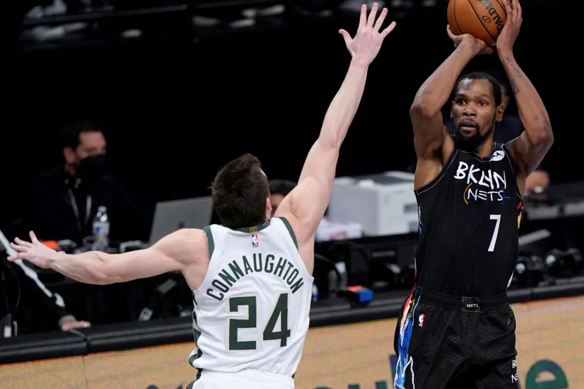 Brooklyn Nets forward Kevin Durant (7) shoots as Milwaukee Bucks guard Pat Connaughton (24) defends during the fourth quarter of Game 5 of a second-round NBA basketball playoff series in New York, on June 15, 2021. (Kathy Willens/AP Photo)