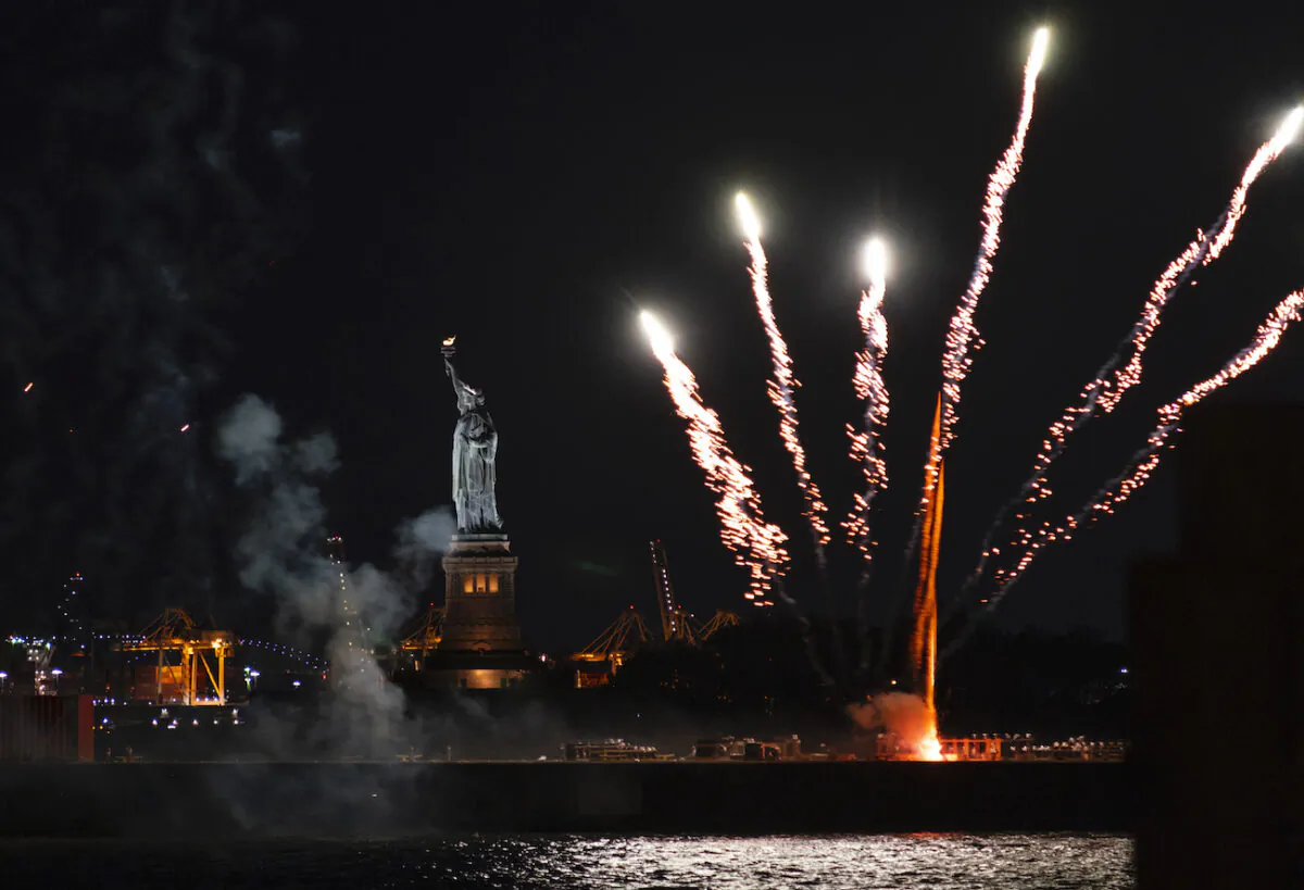Fireworks explode over New York Harbor and the Statue of Liberty as New York state marks the end of the COVID-19 restrictions and honor frontline workers, in New York City on June 15, 2021.(Craig Ruttle/AP Photo)