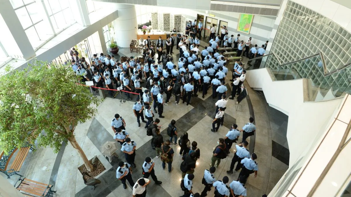 Police officers conduct a raid at the Apple Daily office in Hong Kong, China, on June 17, 2021. (Apple Daily via Getty Images)