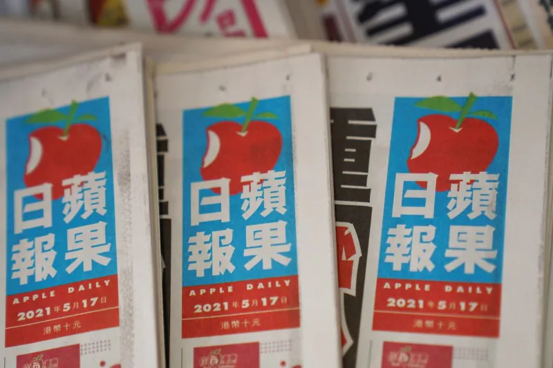 Copies of Next Digital's Apple Daily newspapers are seen at a newsstand in Hong Kong on May 17, 2021. (Lam Yik/Reuters)
