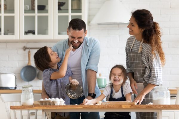 family having fun cooking and laughing together