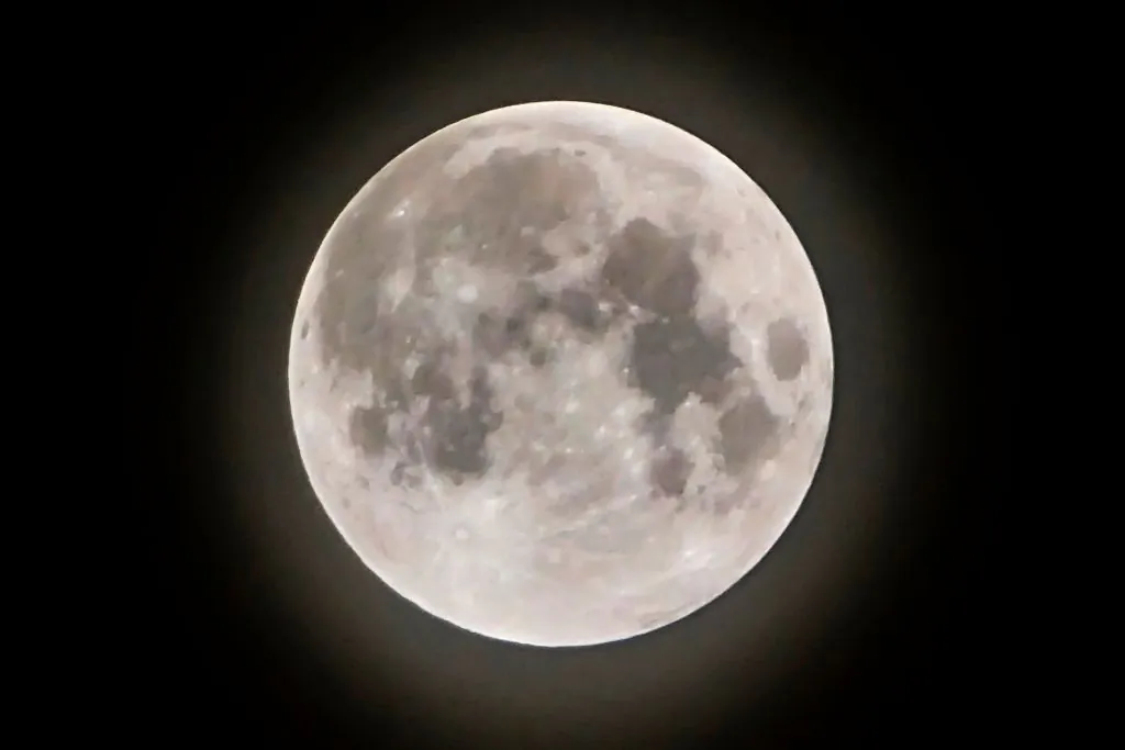 The full moon, known as Strawberry Moon, seen from Jakarta before a penumbral lunar eclipse, on June 6, 2020. (Bay Ismoyo/AFP via Getty Images)