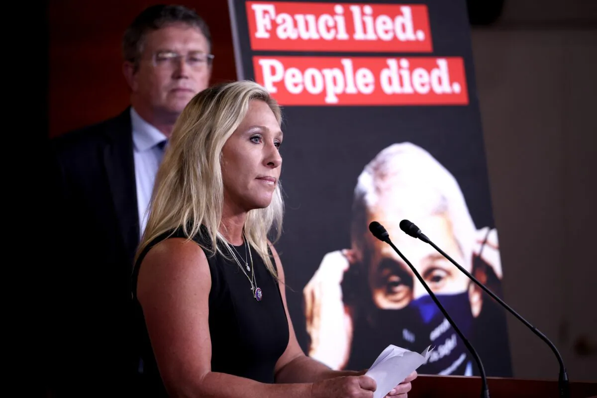 Rep. Marjorie Taylor Greene (R-Ga.) speaks at a news conference, with Rep. Thomas Massie (R-Ky.) in the background, on the “Fire Fauci Act” on Capitol Hill in Washington on June 15, 2021. (Anna Moneymaker/Getty Images)