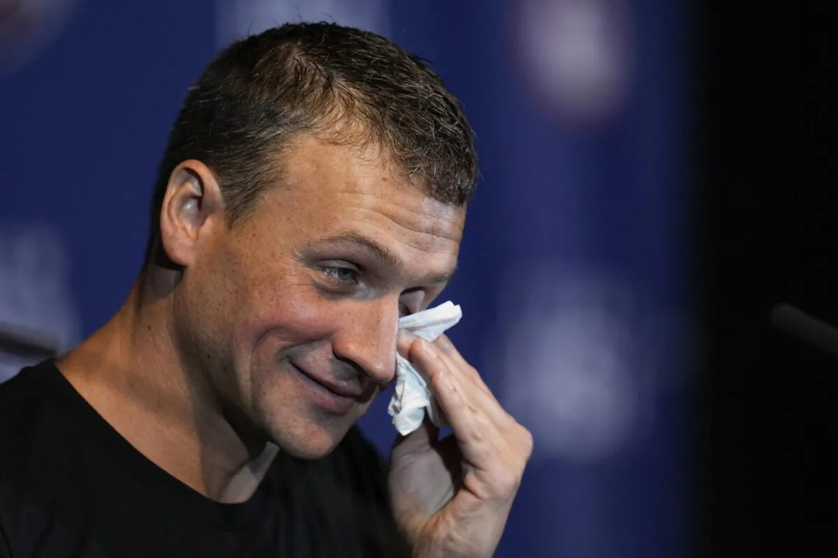 Ryan Lochte crys during an interview after the men's 200 individual medley during wave 2 of the U.S. Olympic Swim Trials in Omaha, Neb., on June 18, 2021. (Jeff Roberson/AP Photo)