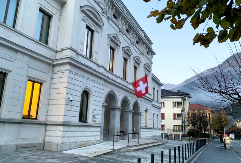 Switzerland's national flag is displayed on the Swiss Federal Criminal Court (Bundesstrafgericht) building in Bellinzona, Switzerland, on Dec. 3, 2020. (Emma Farge/Reuters)