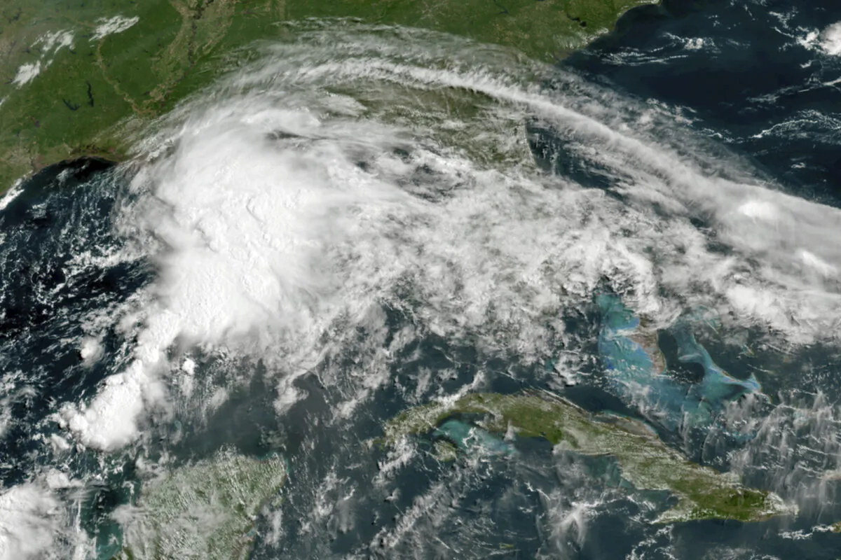 A tropical weather system in the Gulf of Mexico in this GOES-16 GeoColor satellite image taken at 11 a.m. ET on June 18, 2021. (NOAA via AP)