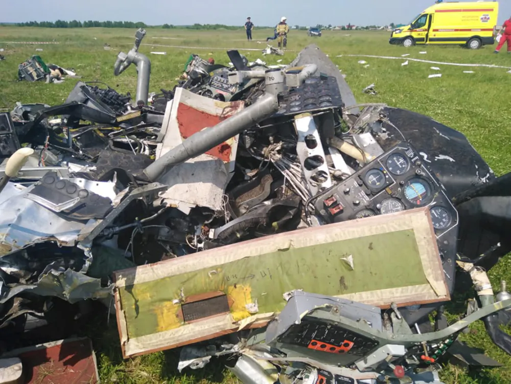A view shows the wreckage of an L-410 plane that crashed near the Tanay aerodrome, which provides parachuting services, in Kemerovo Region, Russia, on June 19, 2021. (Investigative Committee of Russia/Handout via Reuters)
