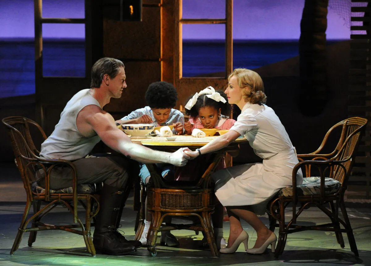(L –R) New Zealand's Teddy Tahu Rhodes as Emile De Becque, with Jamal Sydney Bednarz as Jerome, Ayanda Dladla as Ngana, and Australia's Lisa McCune as Nellie Forbush for the Lincoln Center Theater production of “South Pacific” at the Sydney Opera House in 2012. (TORSTEN BLACKWOOD/AFP/Getty Images)