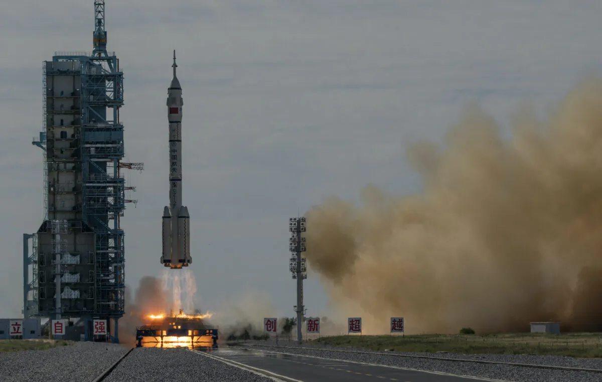 The manned Shenzhou-12 spacecraft from China's Manned Space Agency onboard the Long March-2F rocket launches with three Chinese astronauts onboard at the Jiuquan Satellite Launch Center in China's Gansu Province, on June 17, 2021. (Kevin Frayer/Getty Images)