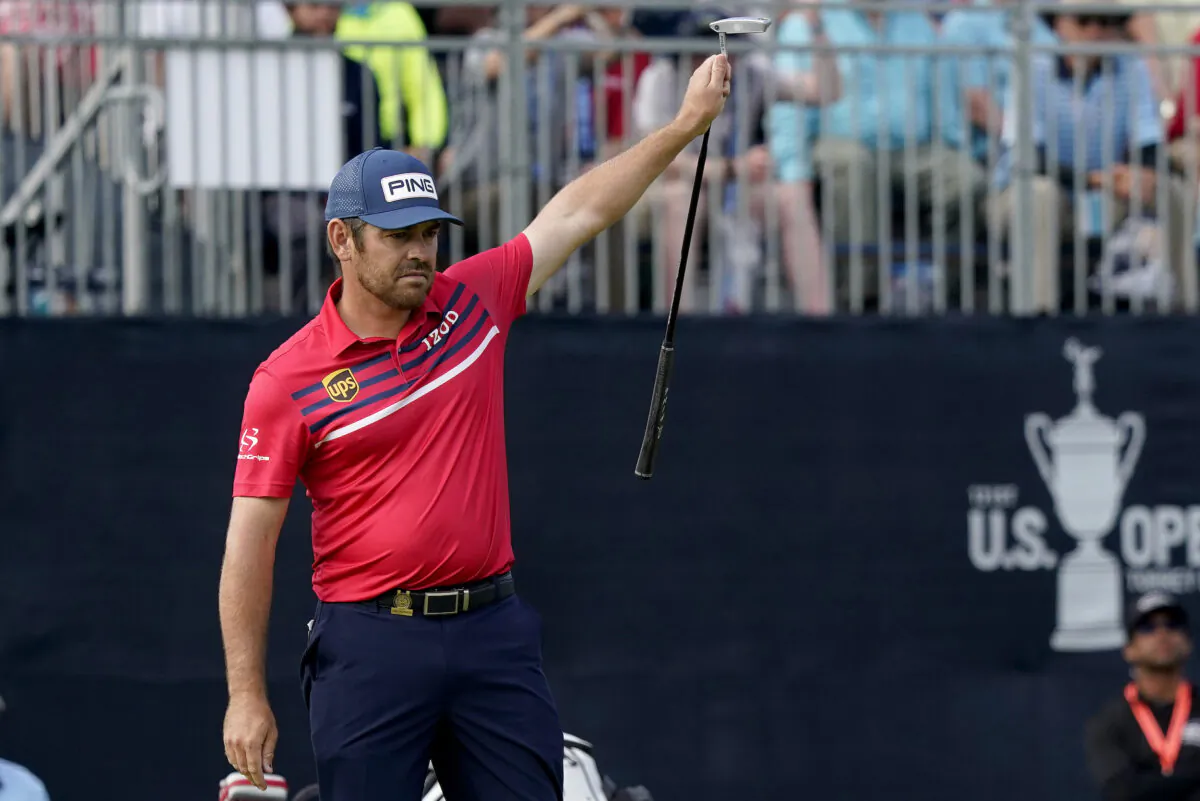 Louis Oosthuizen, of South Africa, reacts to making his eagle putt on the 18th green during the third round of the U.S. Open Golf Championship at Torrey Pines Golf Course in San Diego, Calif., on June 19, 2021. (Marcio Jose Sanchez/AP Photo)