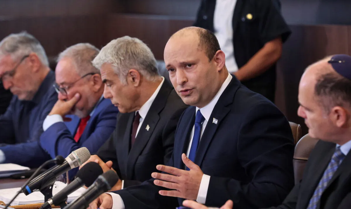 Israeli Prime Minister Naftali Bennett speaks as he chairs the first weekly cabinet meeting of his new government in Jerusalem, on June 20, 2021. (Emmanuel Dunand/Pool via Reuters)