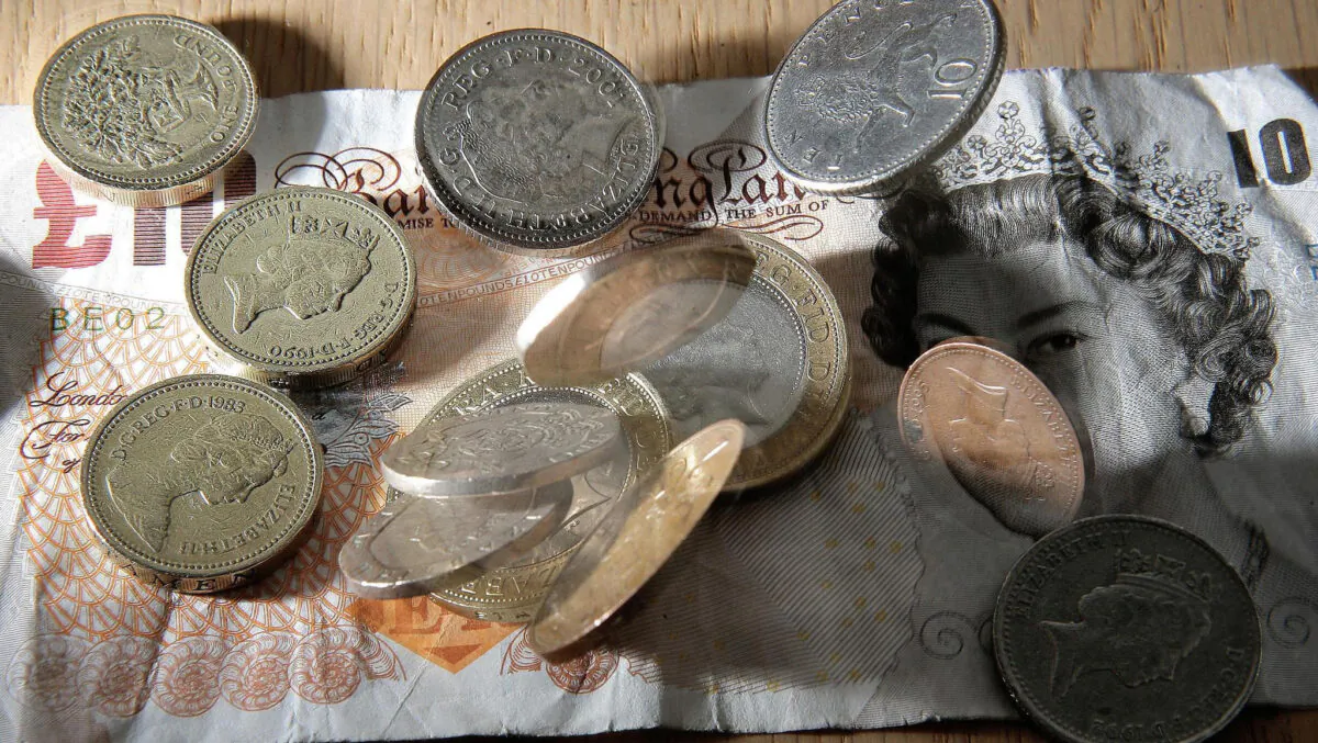 Cash in an undated file photo. (Owen Humphreys/PA)