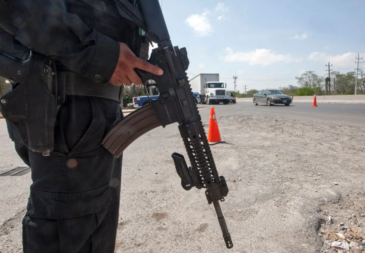 A member of the Federal Police stands guard at a checkpoint in the border city of Reynosa, Tamaulipas state, Mexico, on April 6, 2018. (Julio Cesar Aguilar/AFP via Getty Images)