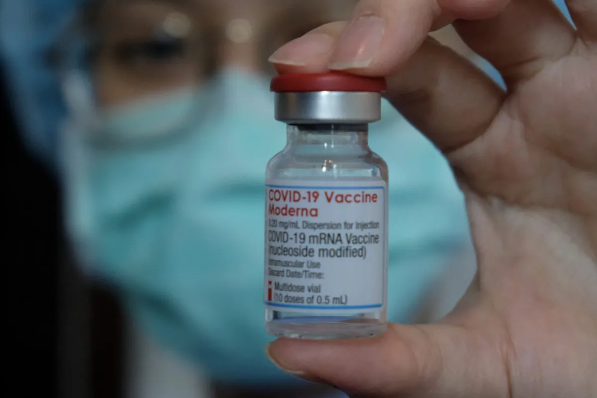 A medical worker displays a Moderna vaccine against the COVID-19 coronavirus at Taipei Tzu Chi Hospital in Taipei on June 9, 2021. (Sam Yeh/AFP via Getty Images)
