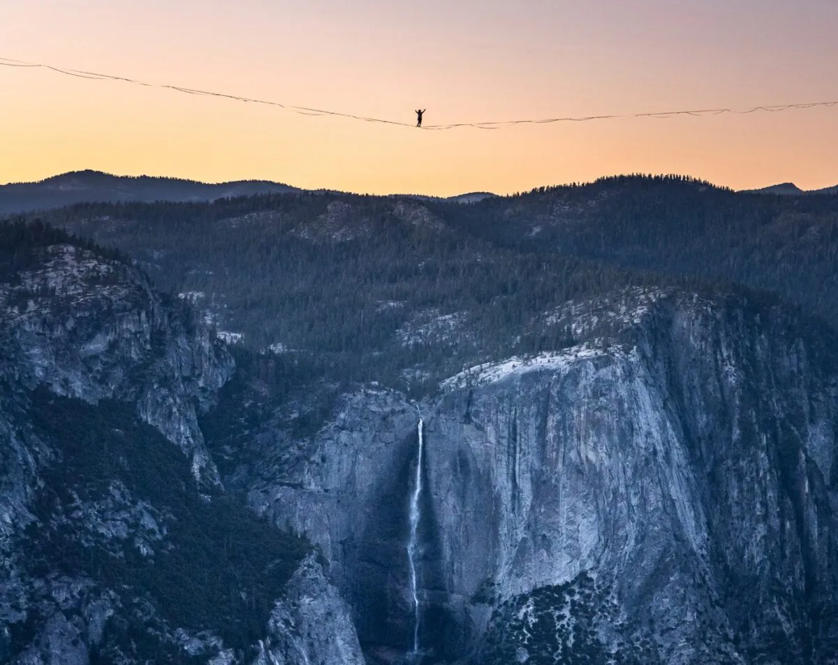 Highliner Daniel Monterrubio walks the 2,800-foot-long line off Taft Point above Yosemite Valley in Yosemite, Calif., on  June 12, 2021. (Scott Oller/Scott Oller Films via AP)