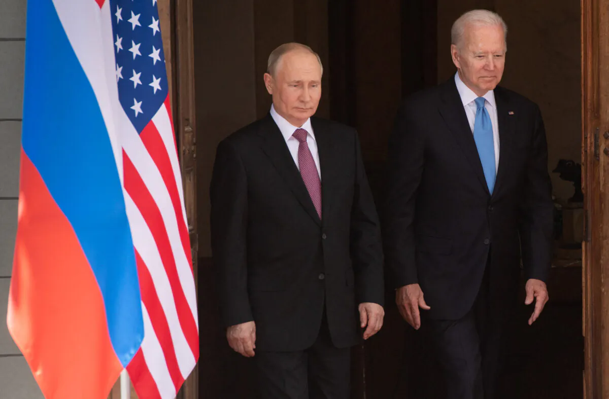 Russian President Vladimir Putin, left, and U.S. President Joe Biden arrive for a summit at Villa La Grange in Geneva on June 16, 2021. (Saul Loeb/Pool/AFP via Getty Images)