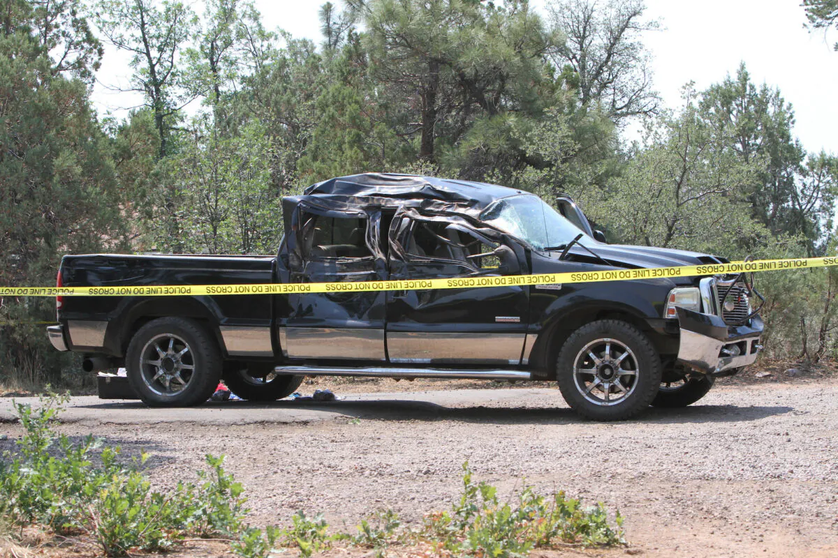 A crashed pick up truck which ran over a group of cyclists in Show Low, Ariz., on June 19, 2021. (Jim Headley/The White Mountain  Independent via AP)